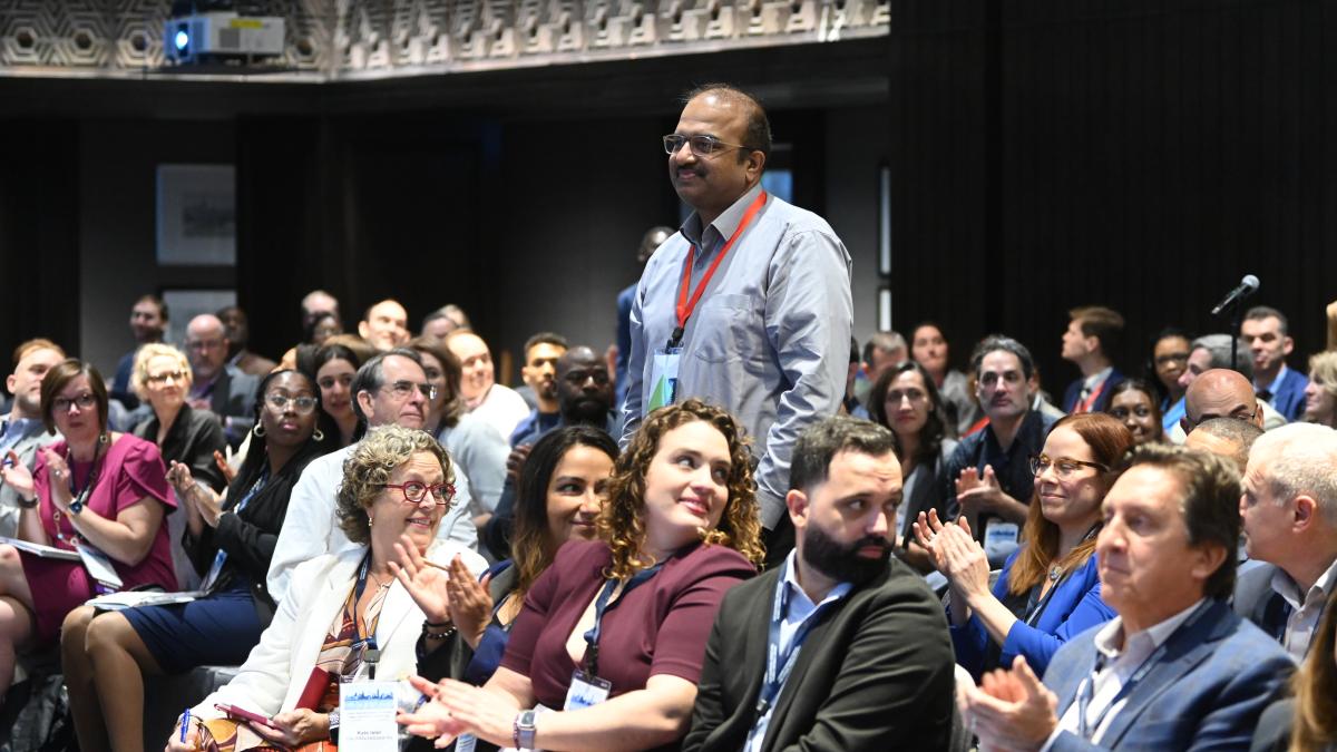 Attendee waiting to ask a question during the USAID Asia Regional Overseas Small Business Conference