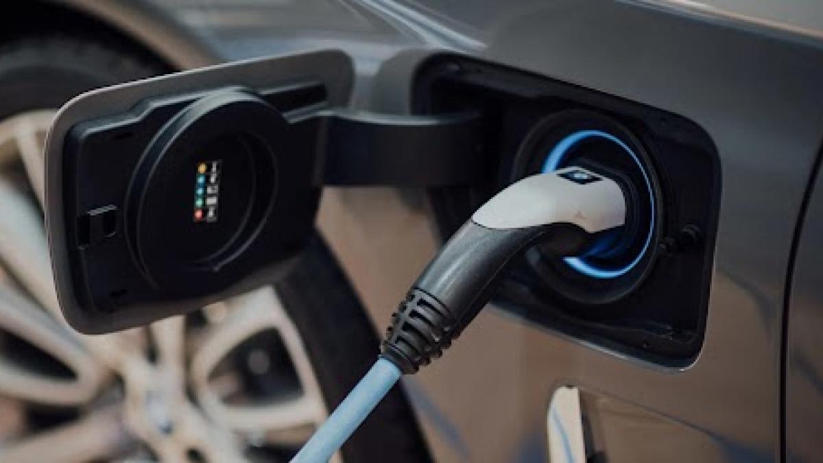 An image of an electric vehicle and charger