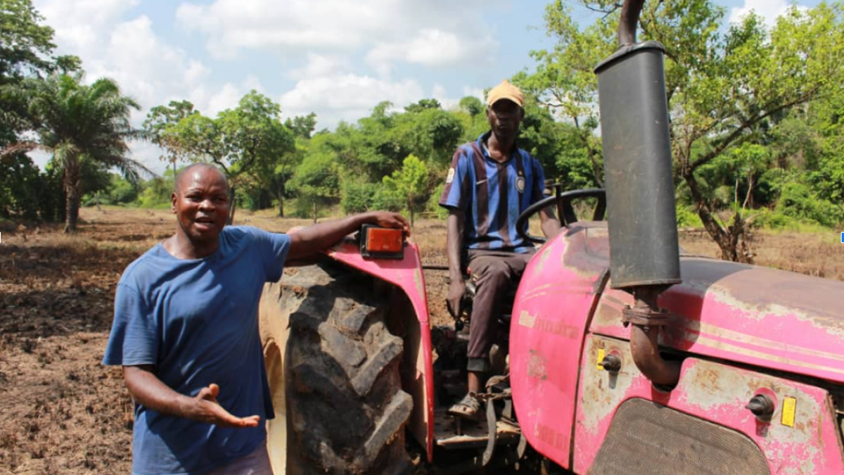 Eji Christopher, CEO of Eji Christopher Tractor Services explains his tractor operations to the Extension Agent during a field visit in Ebonyi State. 