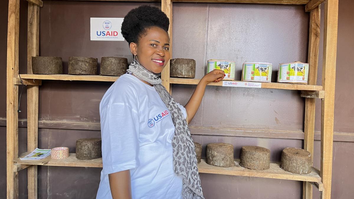 Celine at her shop, with licking blocks on shelves