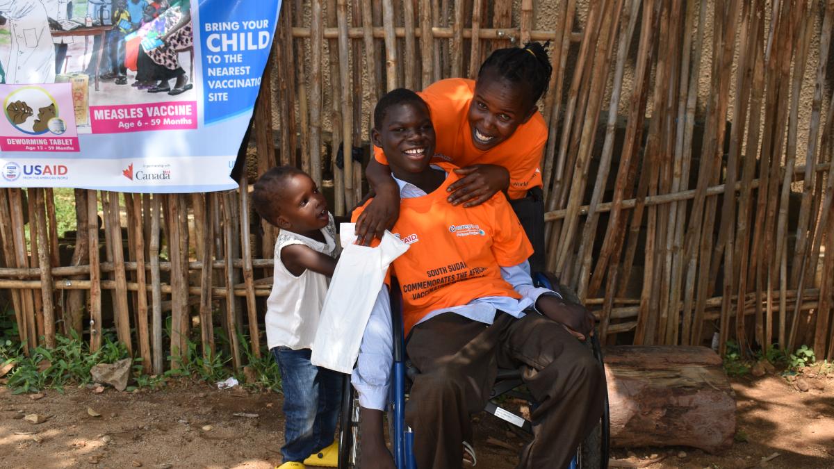 Flora Alfonse (right), a 34-year-old mother of three, poses with her daughters Nivin (middle) 14, a polio survivor, and Sarah (left) 3 at their home in Hai-Baraka, Juba County, Central Equatoria State.