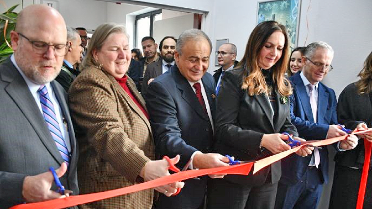 Dignitaries participate in ribbon cutting at the new science labs at The American University in Kosovo during the grand opening celebration.