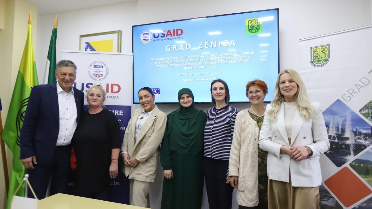 Recipients of grants from USAID INSPIRE pose for a photo at the signing ceremony in Zenica.