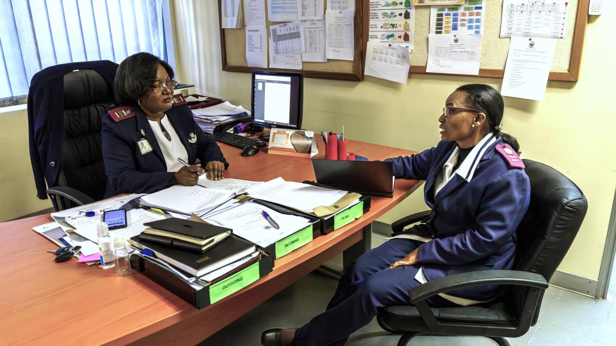 Claudia Kambonde (left) discusses the work roster with Sr. Rosemarie Masule (right). Kambonde coordinates 700 nurses at Windhoek’s Central Hospital.