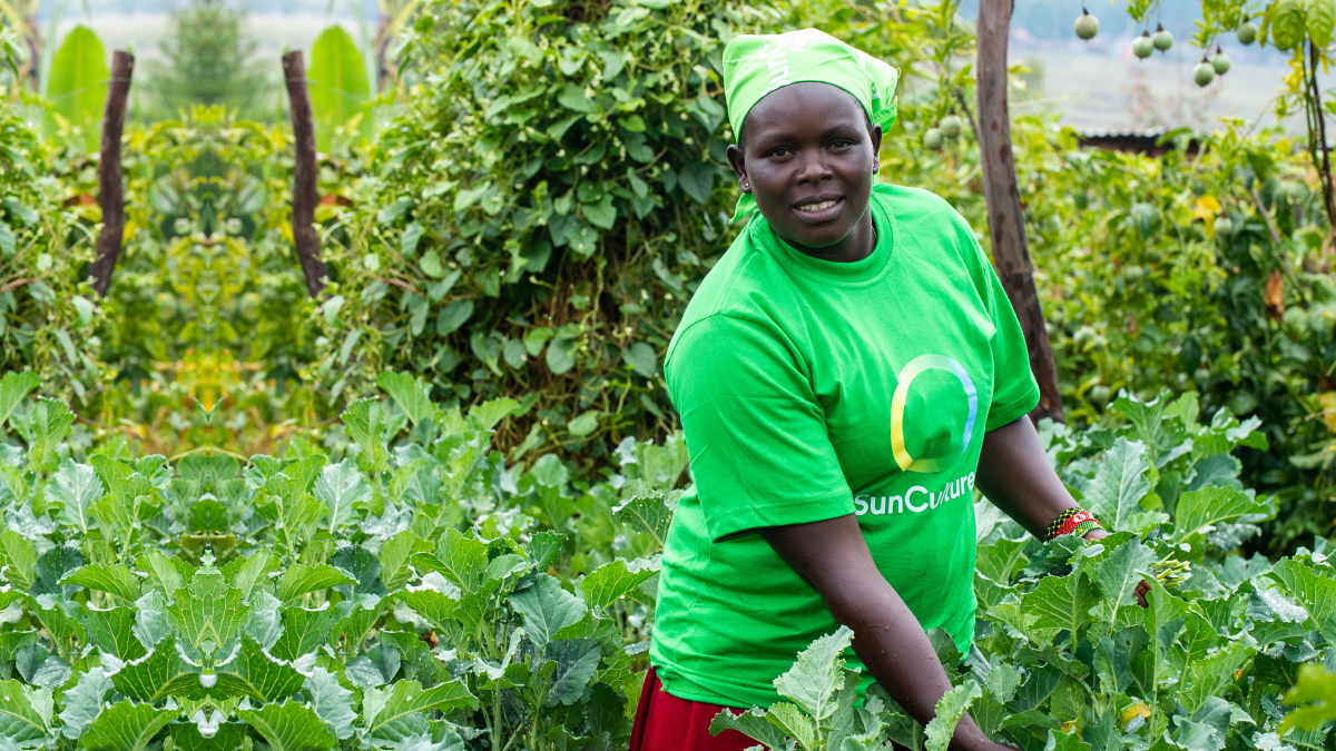 Rachael stands in her high-yield crops.