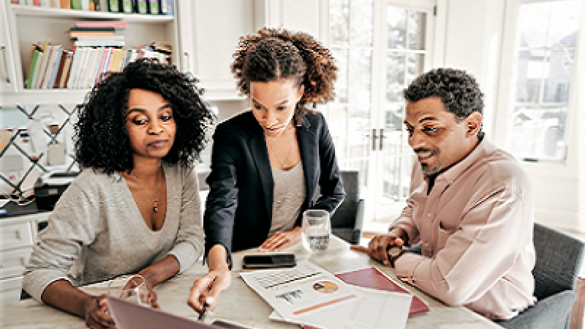 three people in an office