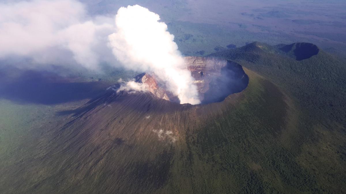 An aerial view of the towering volcanic peak of Mt Nyiragongo