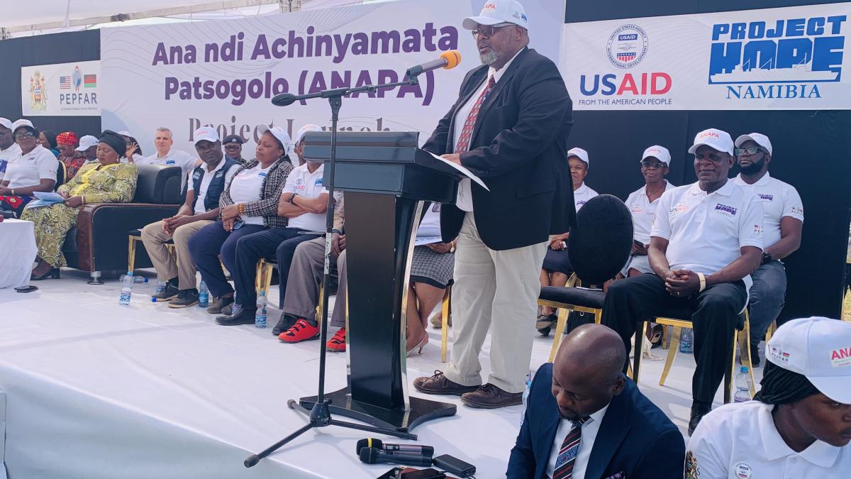 USAID Deputy Health Office Director Dr. Haldon Njikho makes remarks during the launch highlighting the objectives of the five year program which will focus on children and the youth. Photo Credit: Oris Chimenya/USAID