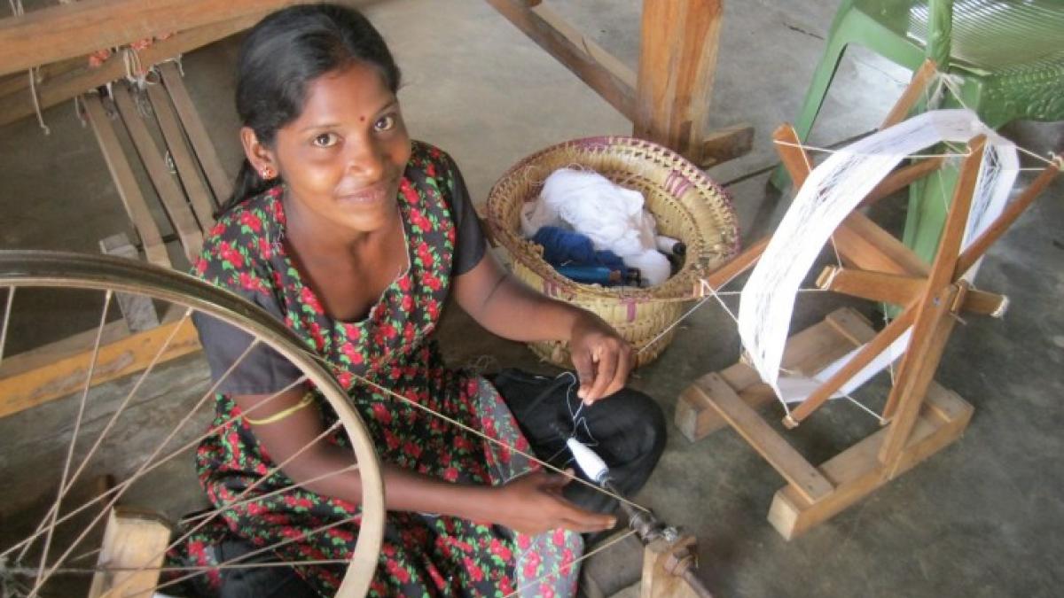 Sri Lankan artisan uses a traditional handloom to make woven clothing. The woman in this picture is using her skills to support her own livelihood, and also create a competitive brand for international markets. IESC's VEGA Facilitating Economic Growth Project seeks to strengthen livelihoods and businesses throughout Sri Lanka. (Photo by IESC / Danielle Wilkins)