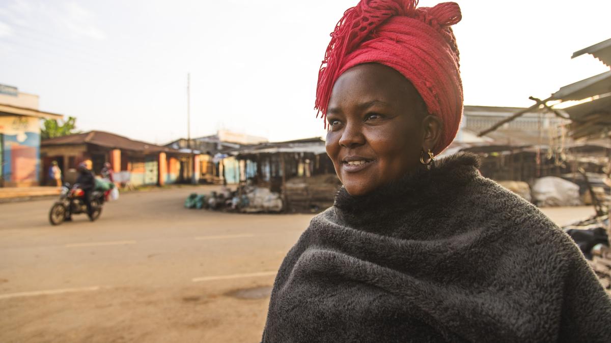 A woman stands for a portrait at the market in Tala, Kenya.