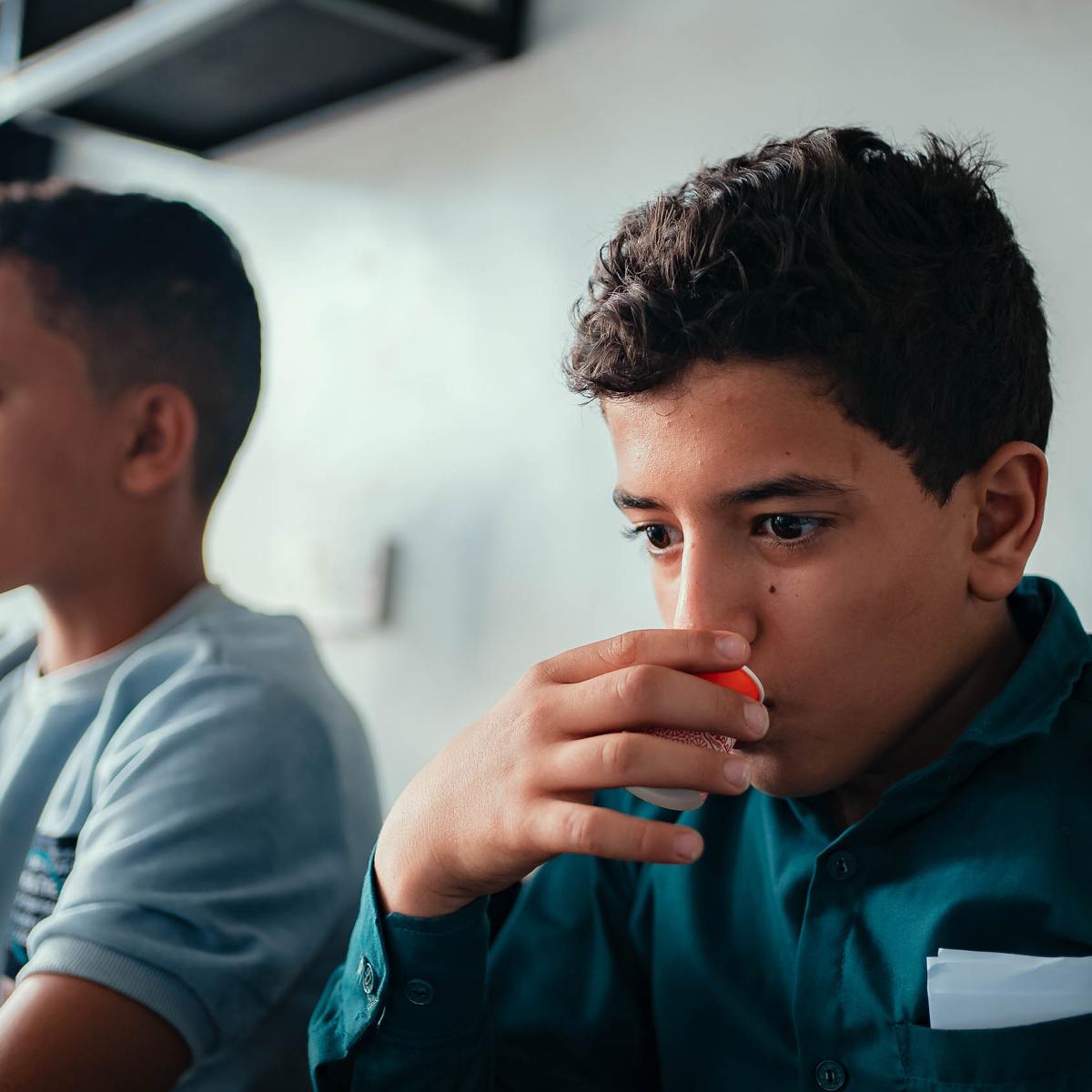 Training participants taste coffee 