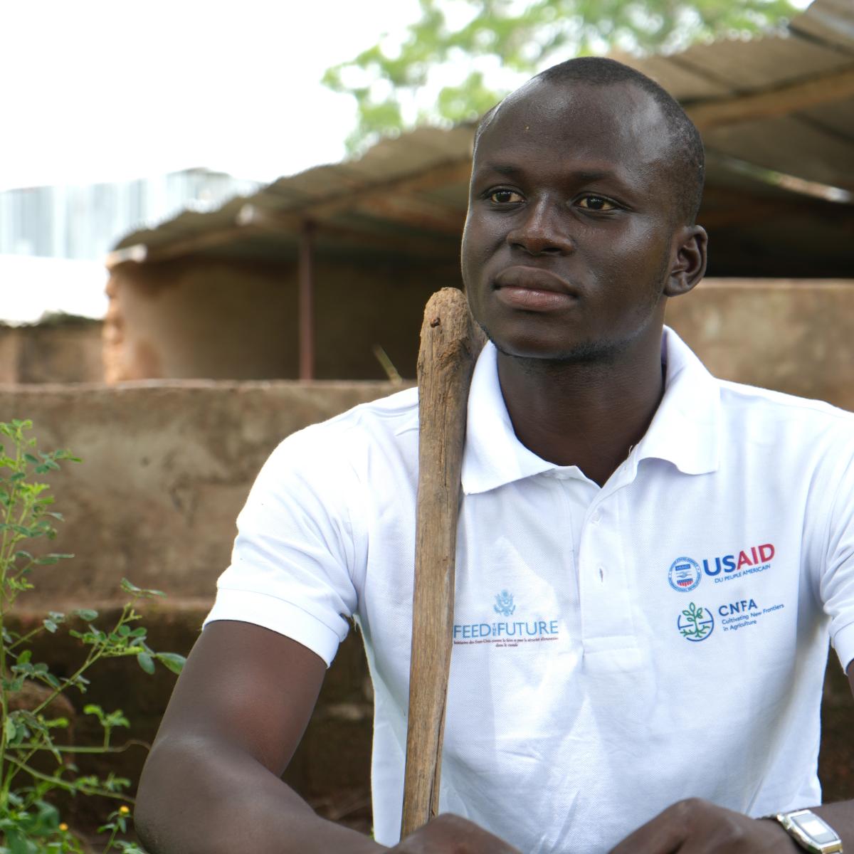 Mamadou Ballo seated in front of the fish pond he used as a composting pit.