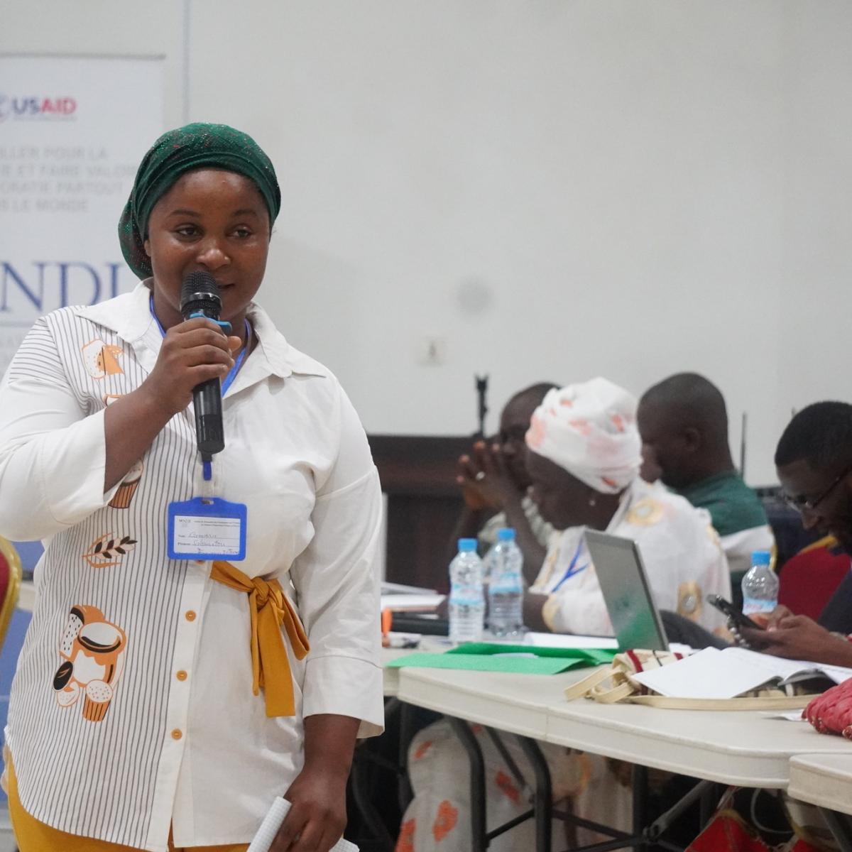 A trainer of trainers addressing participants at the civic and voter education workshop in Conakry in April 2024.