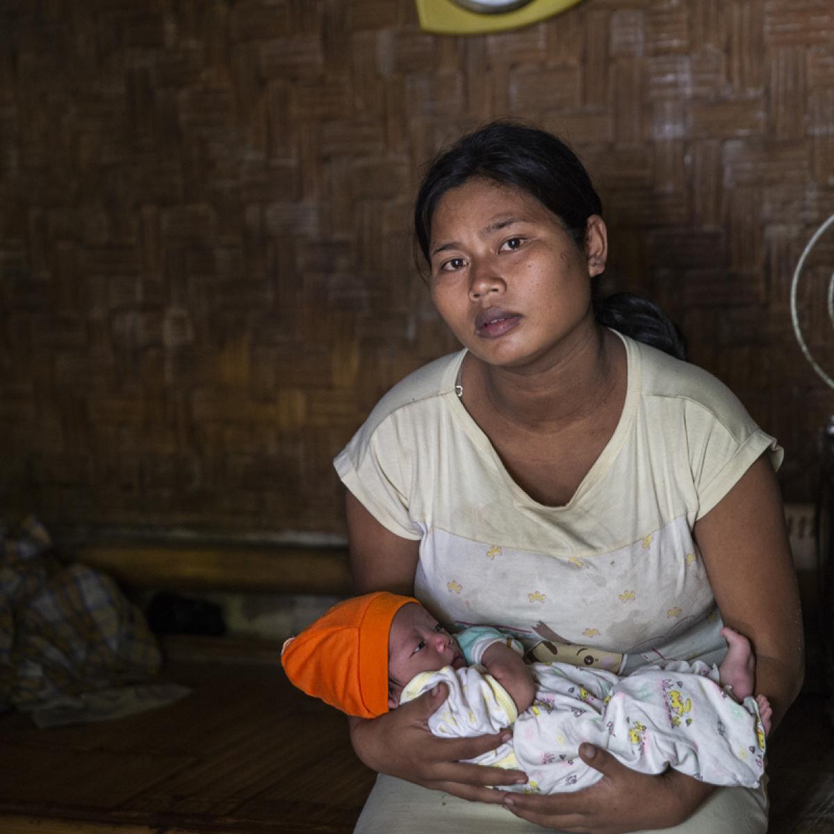 Ibu Asnah with her third son, Restu Pantura.