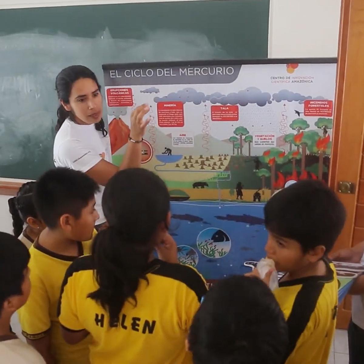 A woman teaching kids about mercury cycle