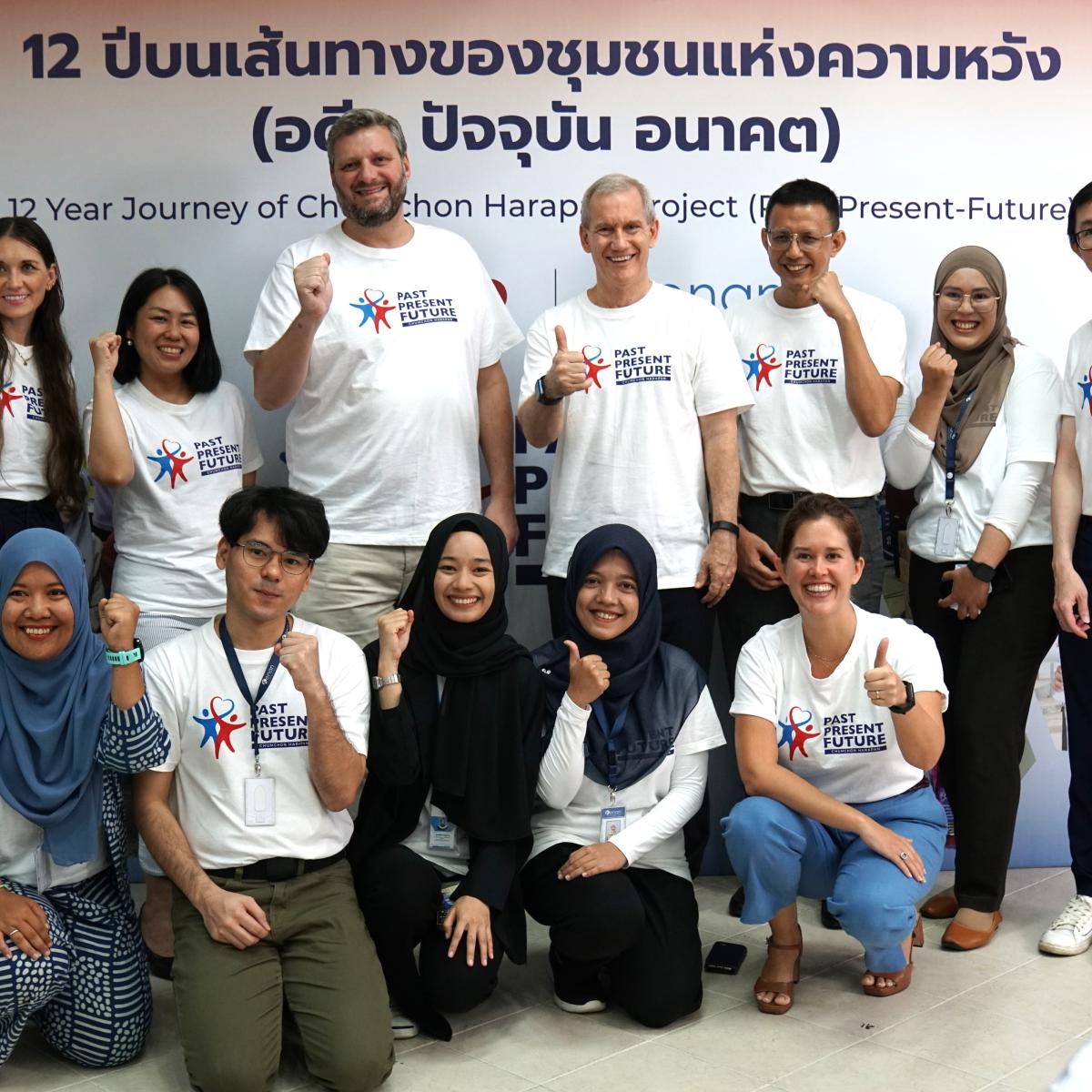 USAID and Chumchon Harapan staff members pose for a group photo at the project closeout event.