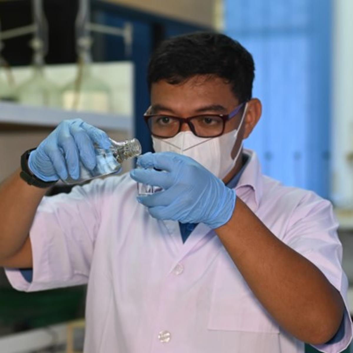 Robby Saputra is testing water quality at Pontianak Water Utility