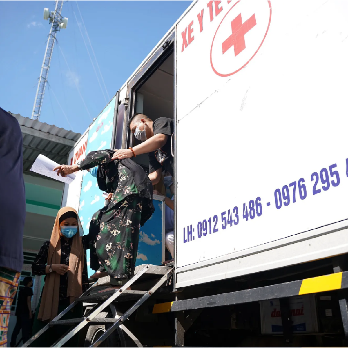 A woman leaves a mobile TB clinic.