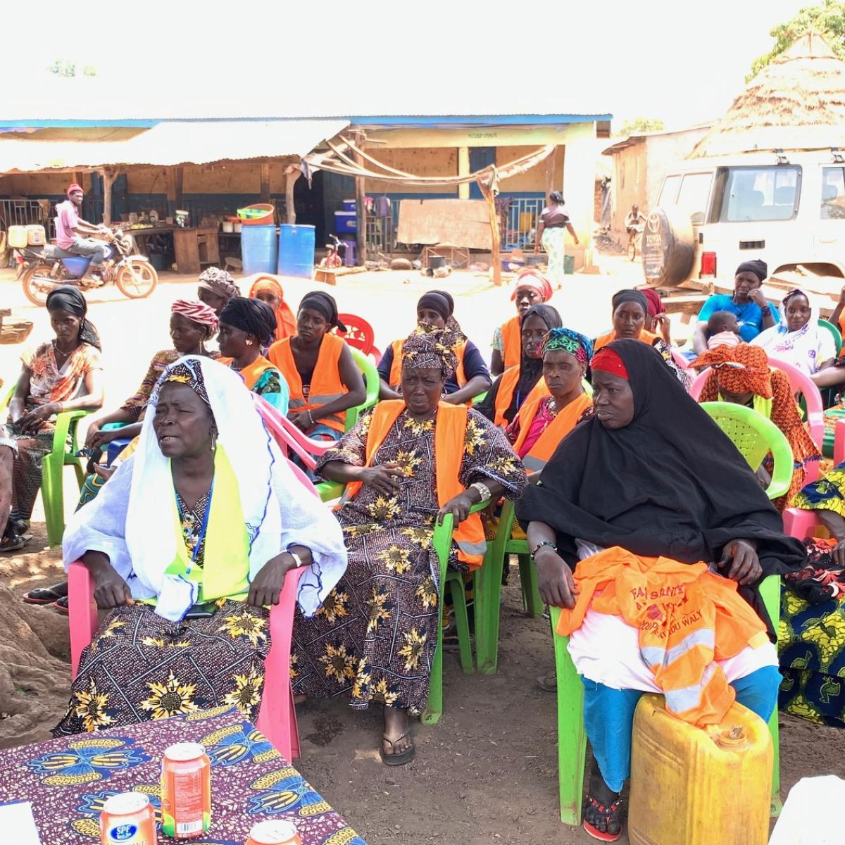 Bebe Camara, wearing white scarf, is one of the women leaders in the Nafadji community. She explains the positive impact of the VSLA on community members.