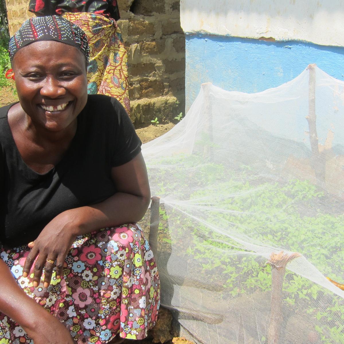 Respect shows off her newly grown peppers