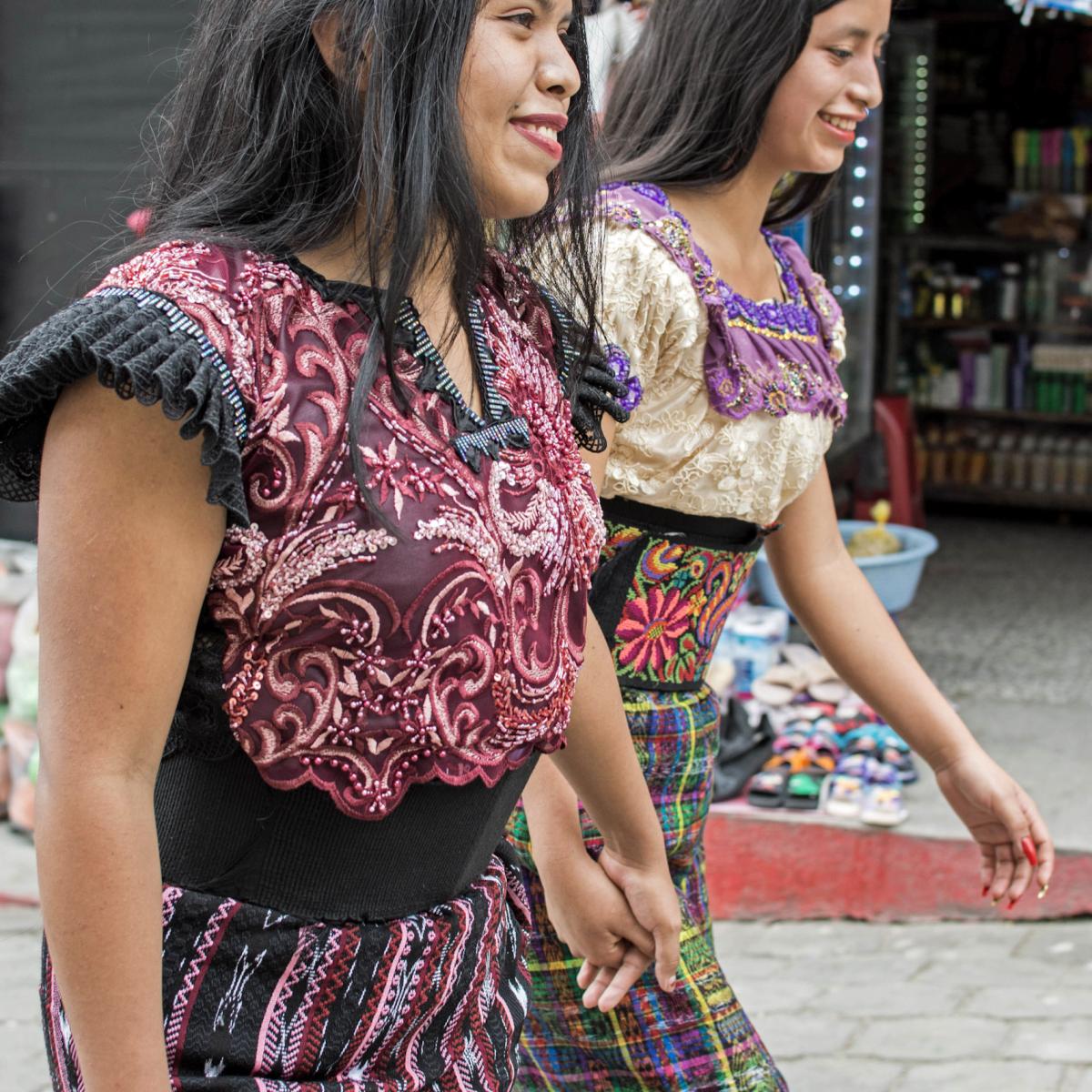 Marta and another woman walking down the street