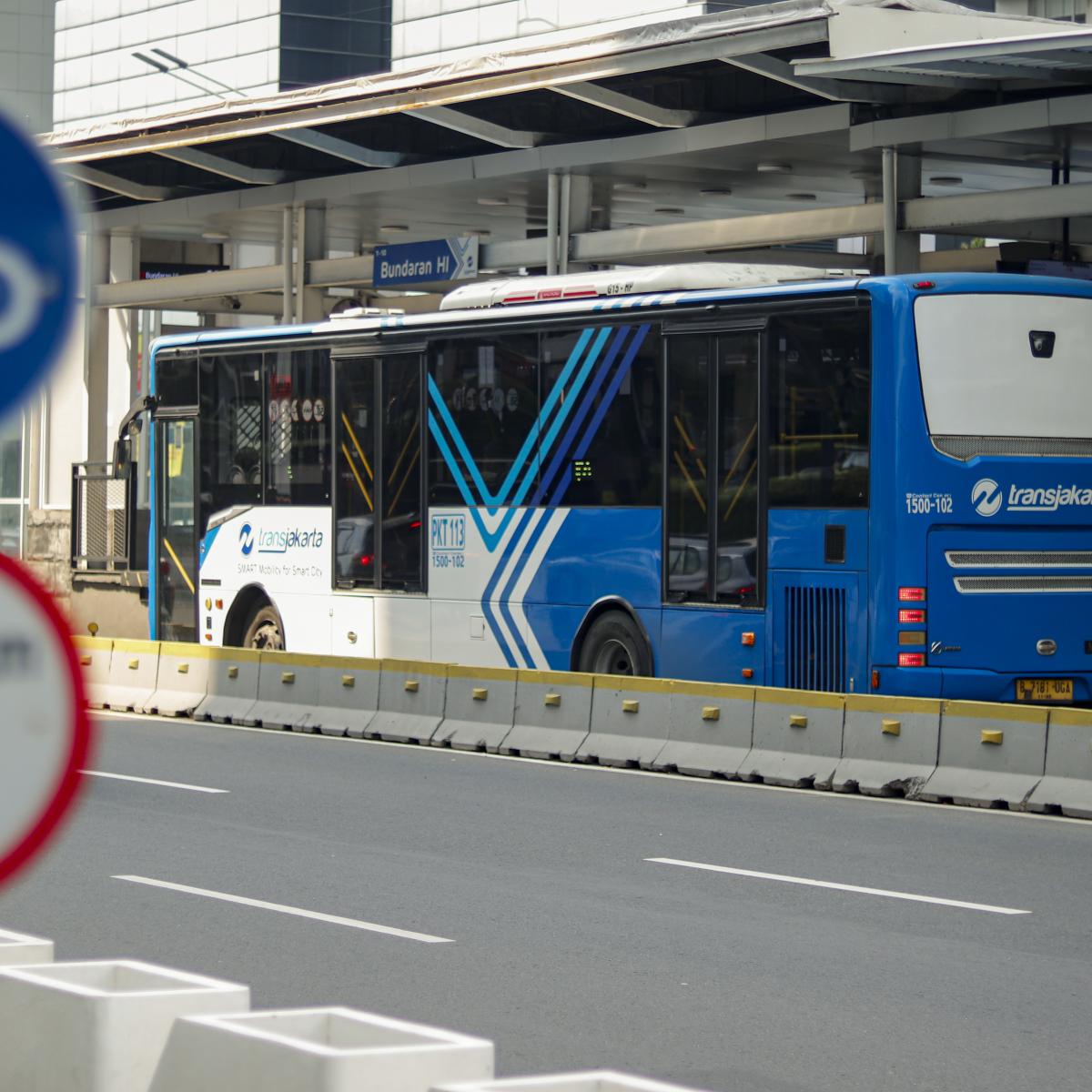 A Transjakarta bus stops at Bundaran HI station in 2021.