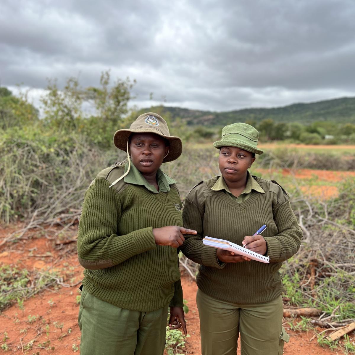 Filster and Violet, SAA-trained rangers carrying out their daily tasks at Kasigau Wildlife Conservancy. They also lead community engagements aimed at confronting and changing harmful gender stereotypes. PHOTO CREDIT: Joyce Mbataru 