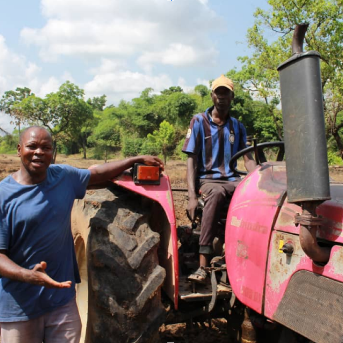 Eji Christopher, CEO of Eji Christopher Tractor Services explains his tractor operations to the Extension Agent during a field visit in Ebonyi State. 