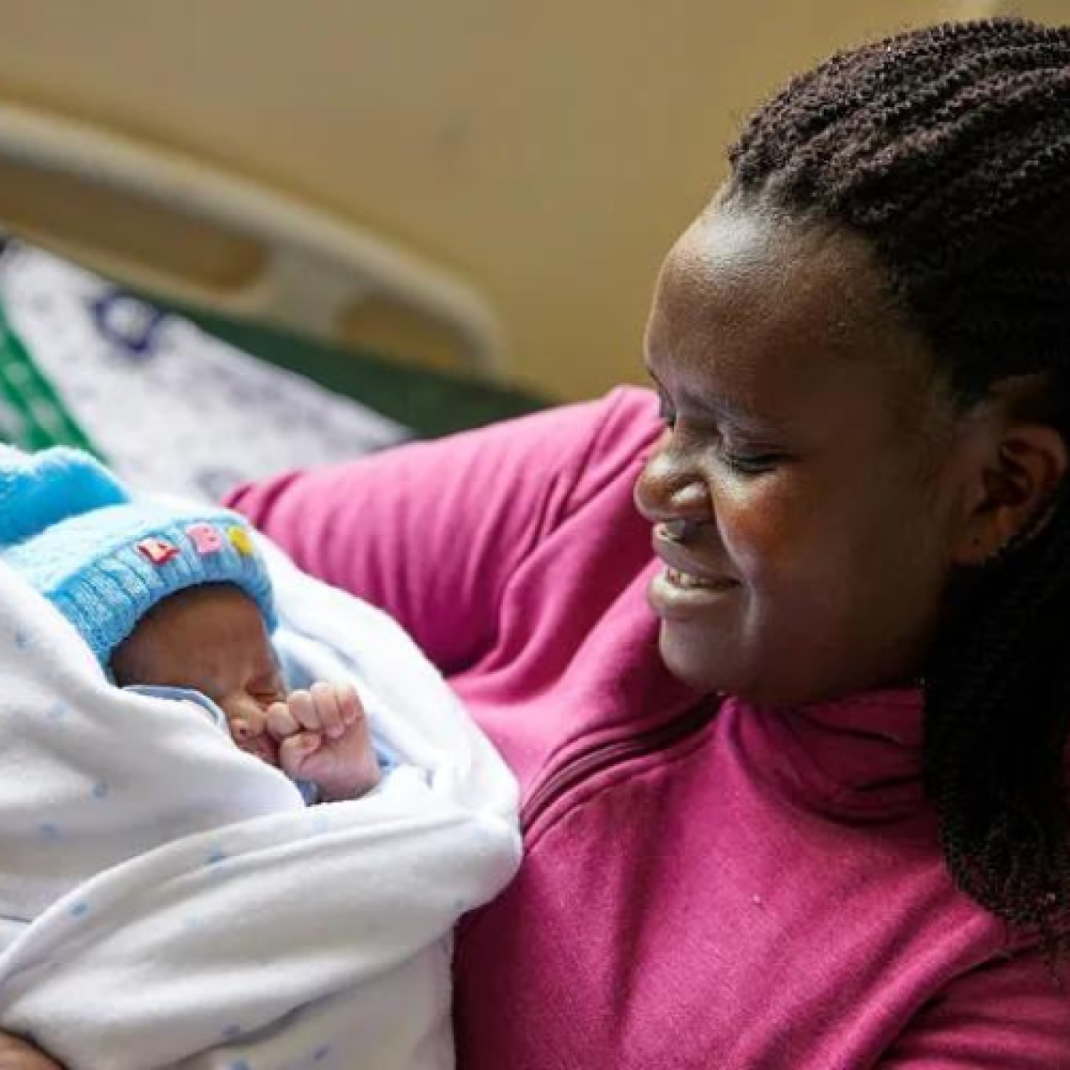 Mother holding her newborn child.