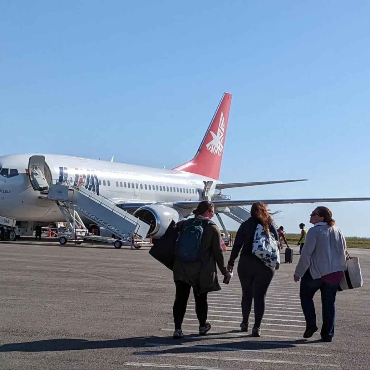 Tourist boarding LAM Flight