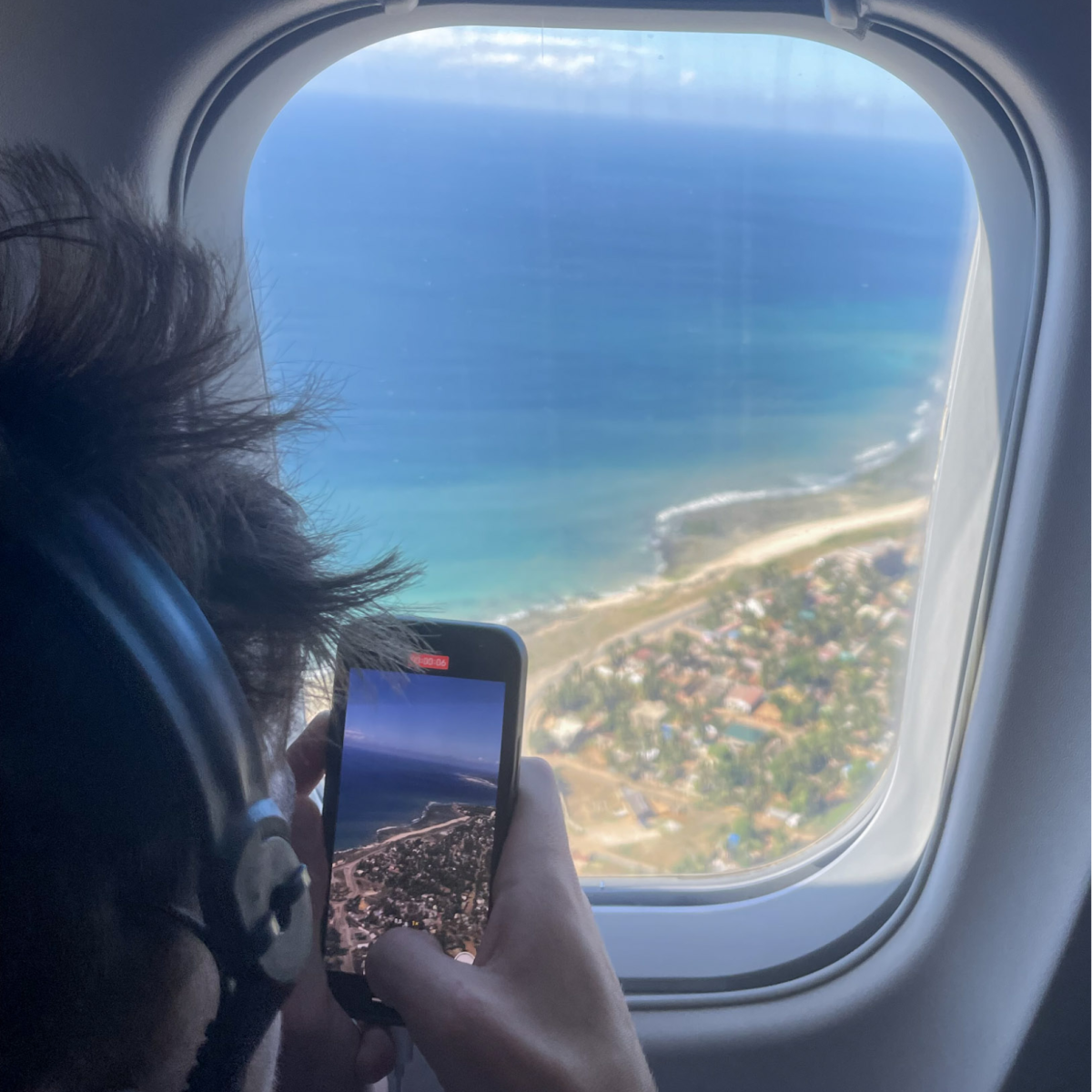 Tourist taking picture on a LAM plane