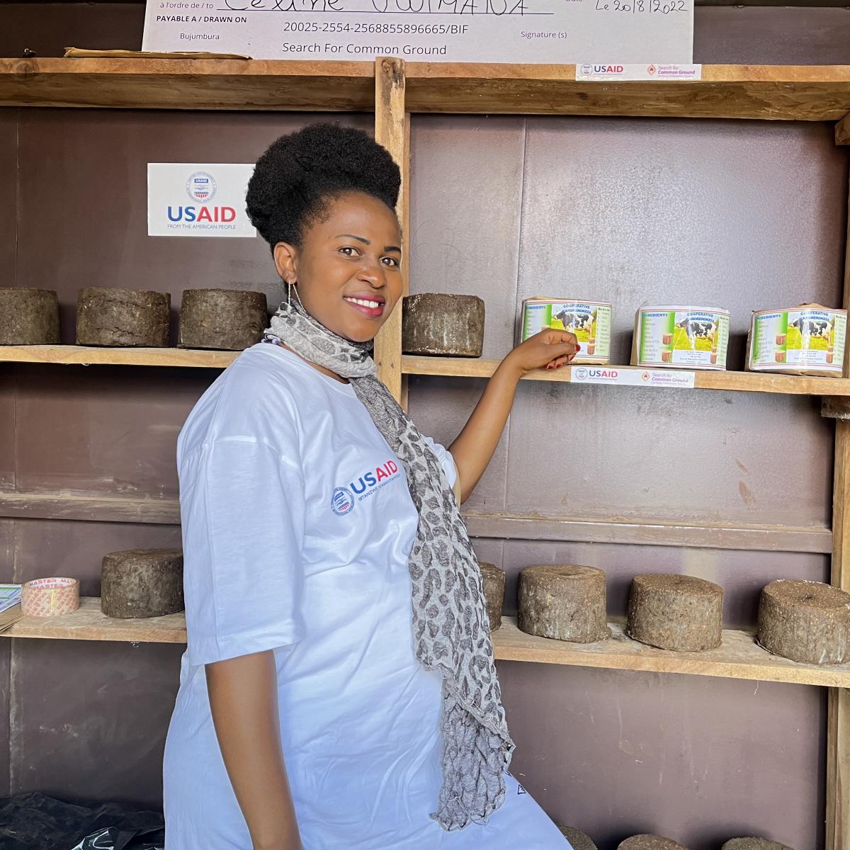 Celine at her shop, with licking blocks on shelves