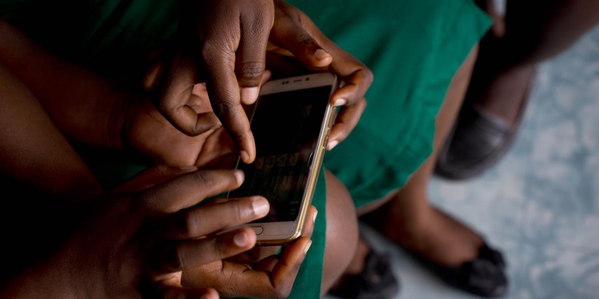 Individual using a phone based application at Cape Coast Midwifery School, Cape Coast, Ghana