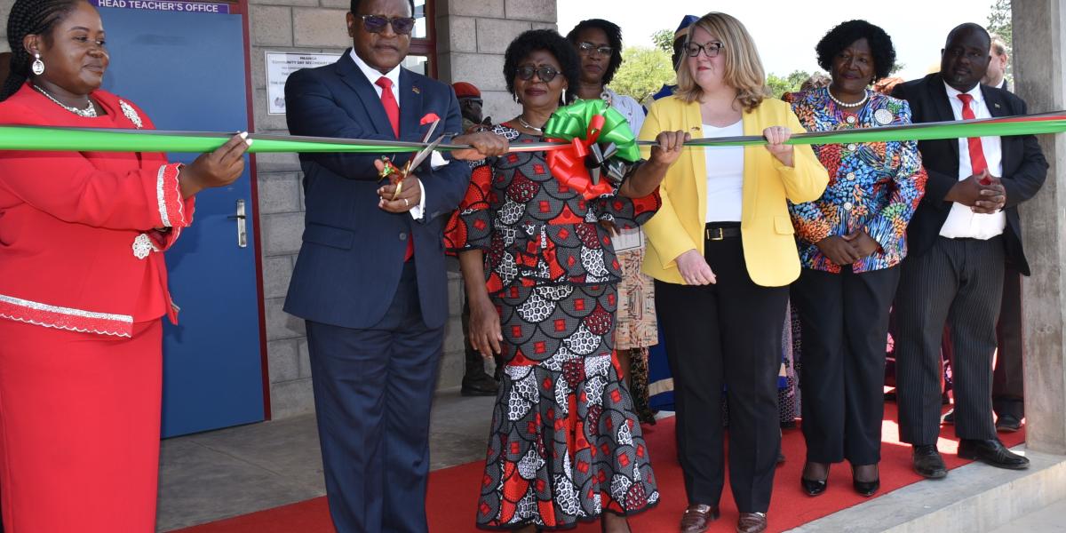 Chargé d’Affaires Amy Diaz, a.i. of U.S. Embassy Lilongwe, and Malawi President Dr.Lazarus Chakwera cut a ribbon during the Mkanga Community Day Secondary school’s ribbon cutting ceremony. Photo Credit: Marcus Muhariwa, U.S. Embassy