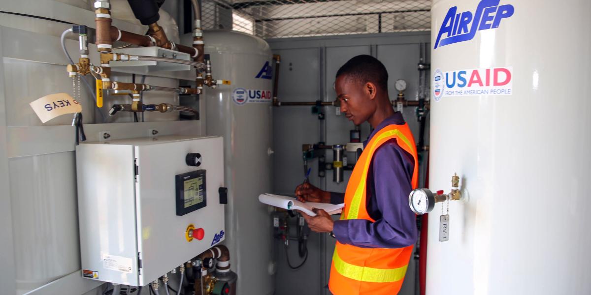 Felisberto operating the oxygen plant control system.