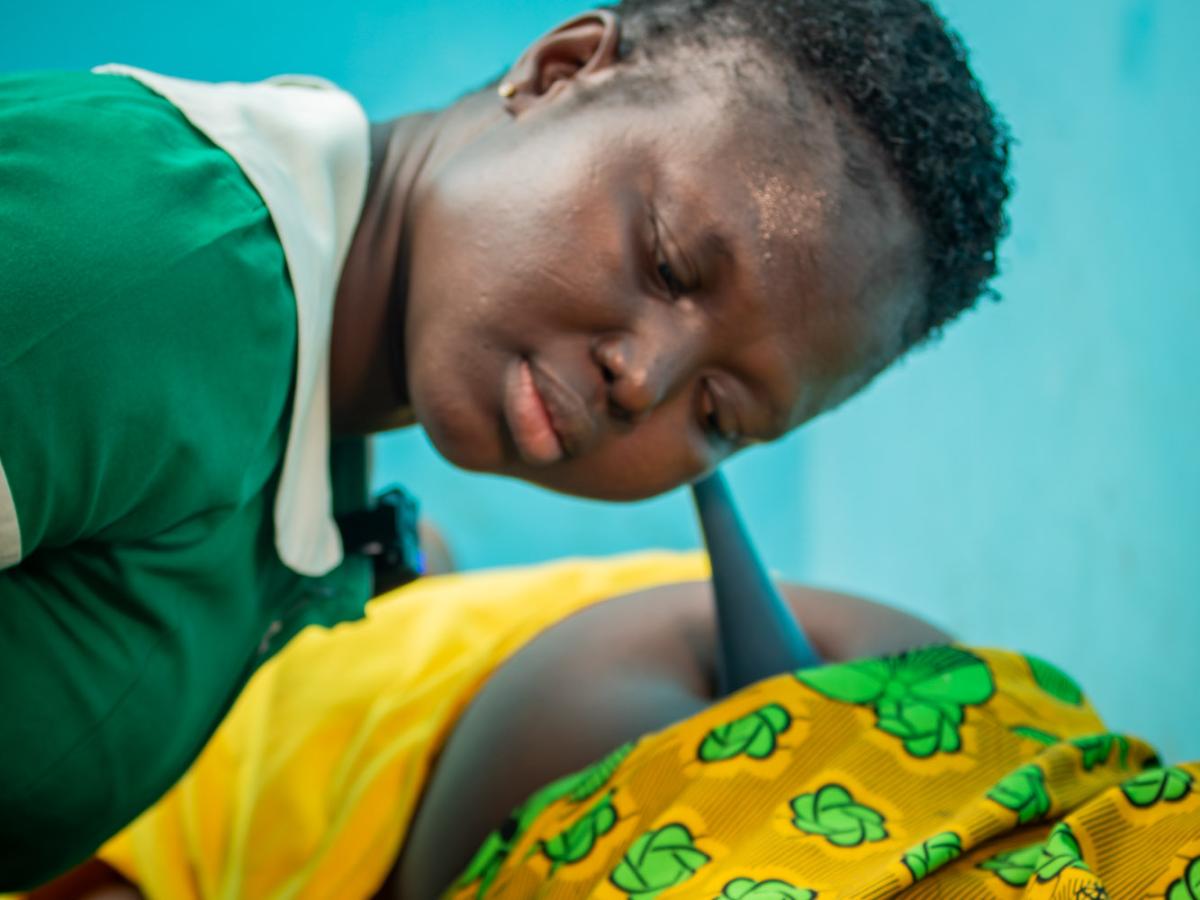 Nurse examining a pregnant woman