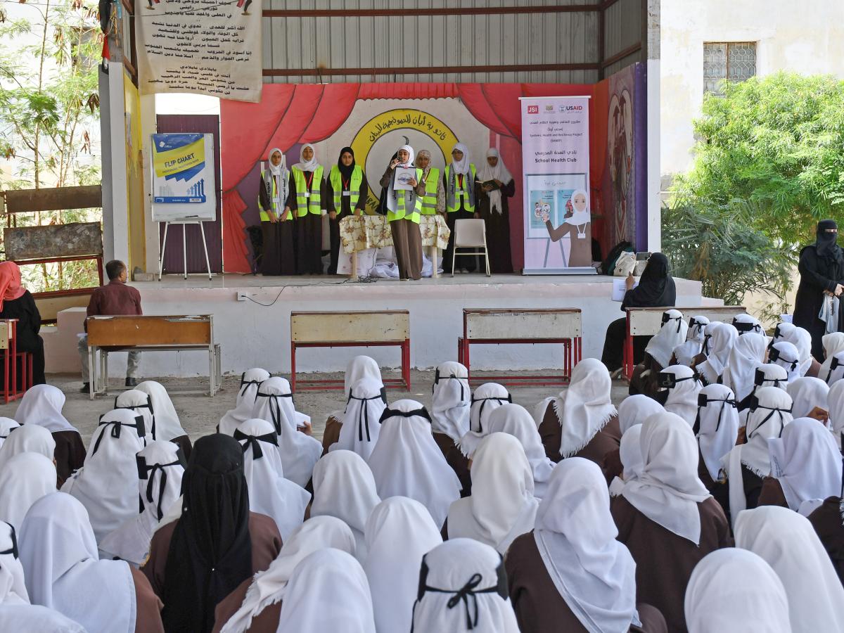 The school health club in Aban Secondary School performs a health awareness song during one of the club’s activities.