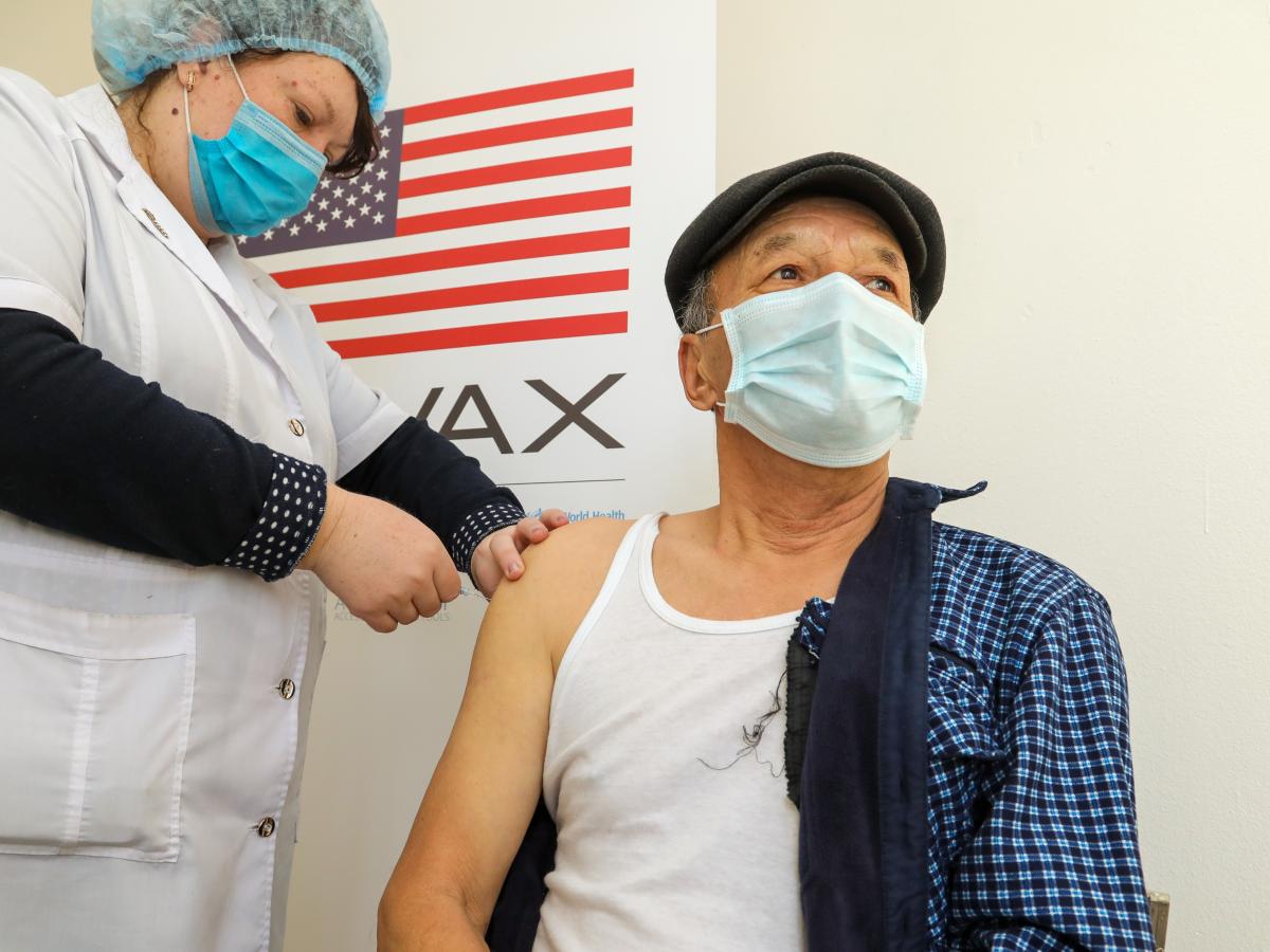 patient is getting a covid-19 vaccine shot