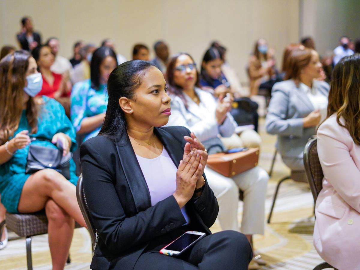 Woman clapping at Engendering Industries training