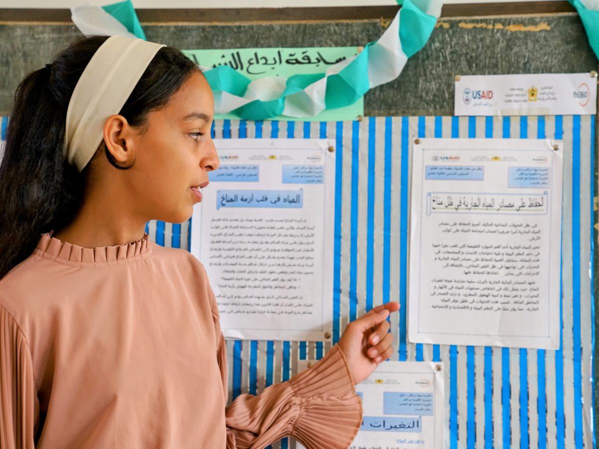 Hafsa Ait Taher, a student at Mohammed V Middle School in Marrakech, presents a paper she wrote on the importance of conserving water resources in light of stark water scarcity and drought.