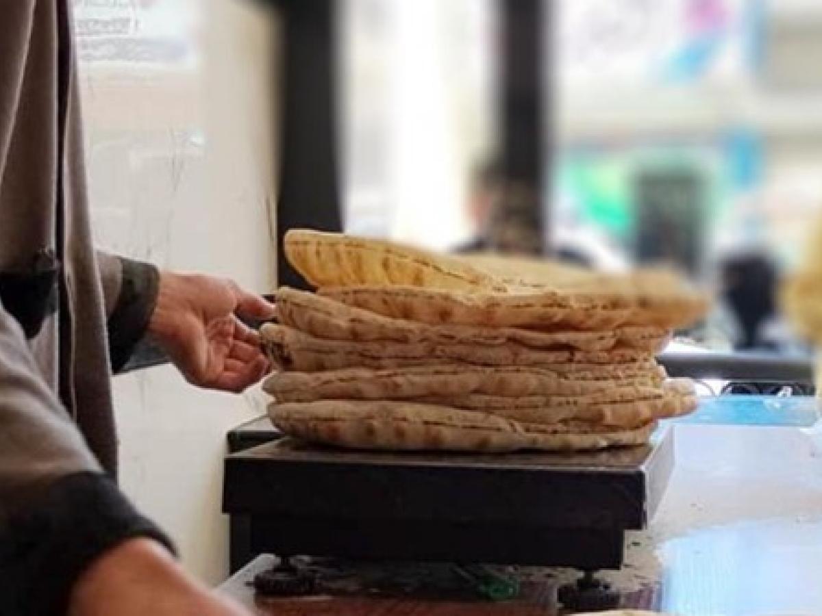 Beneficiary holding bread