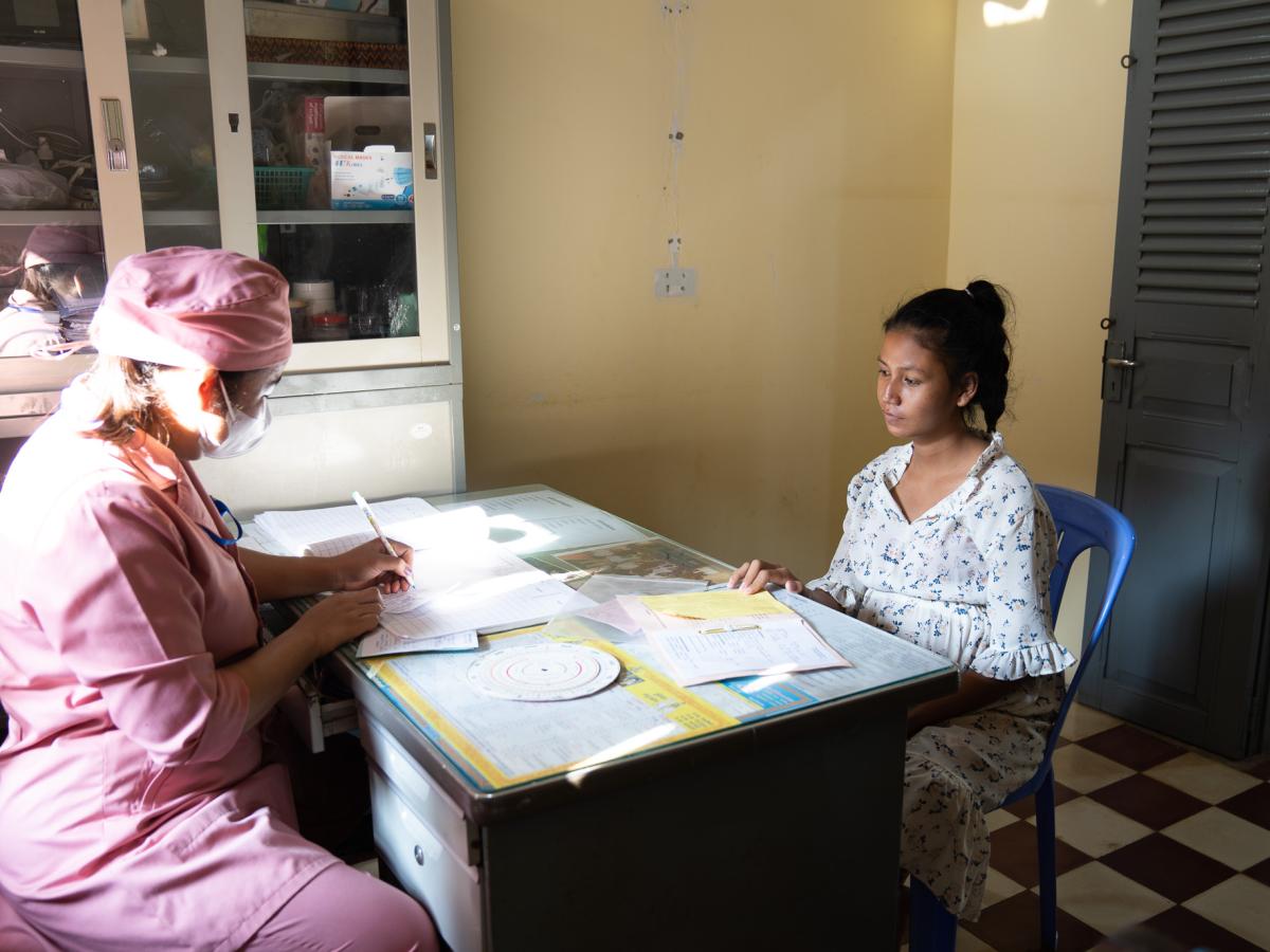 A pregnant woman receives maternal health service at a health center, supported by USAID EQHA project. 