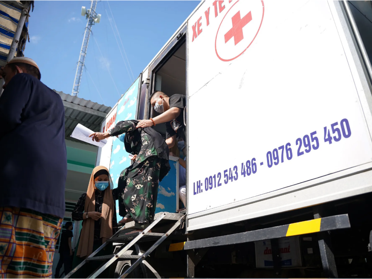 A woman leaves a mobile TB clinic.