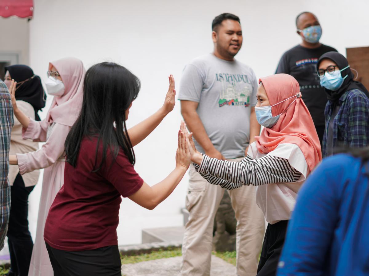 Two students doing high five 