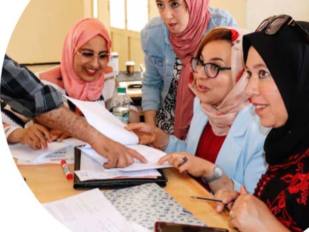 A photo of four Moroccan women working together at a training