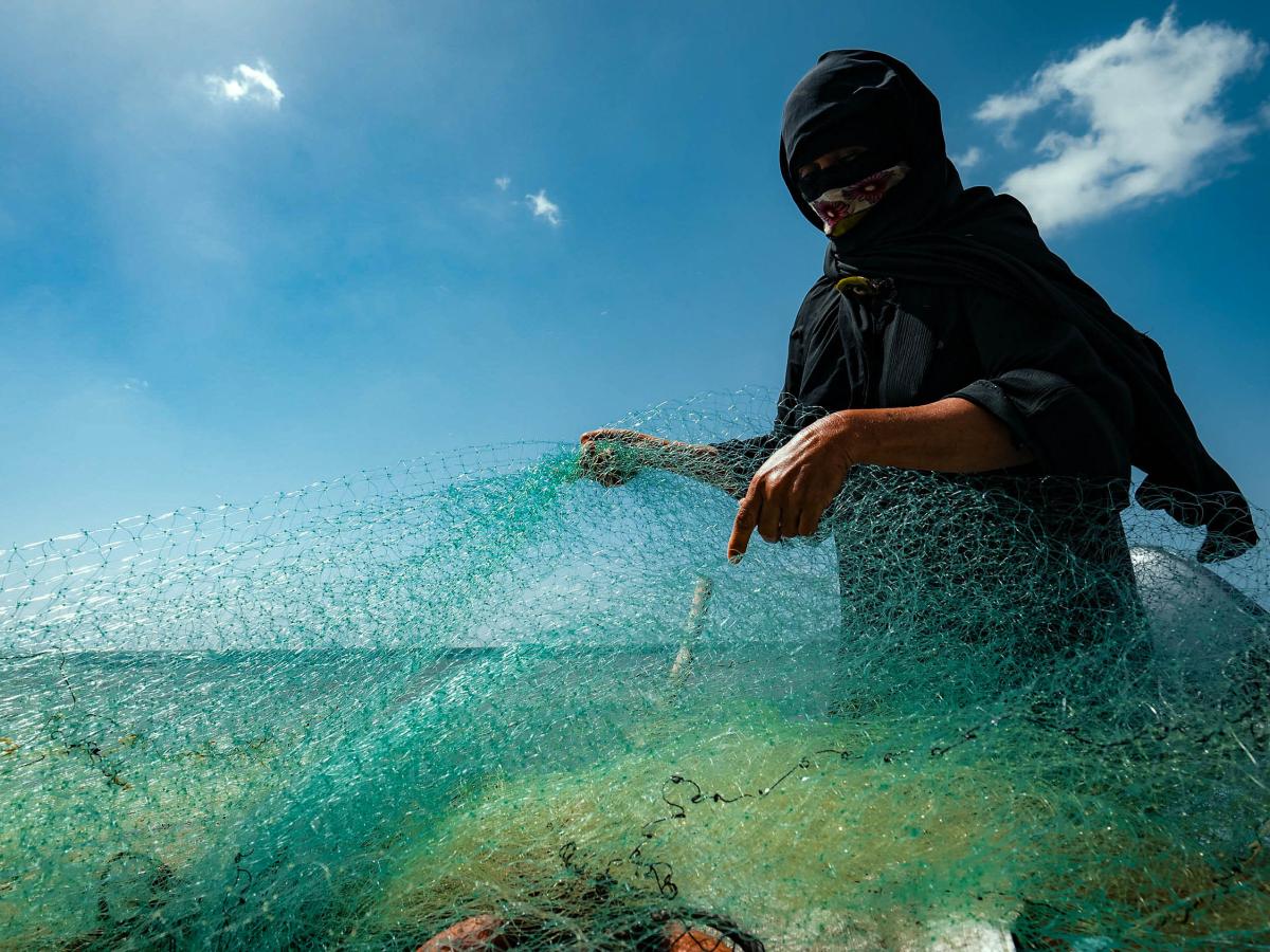 coastal woman with fishing net