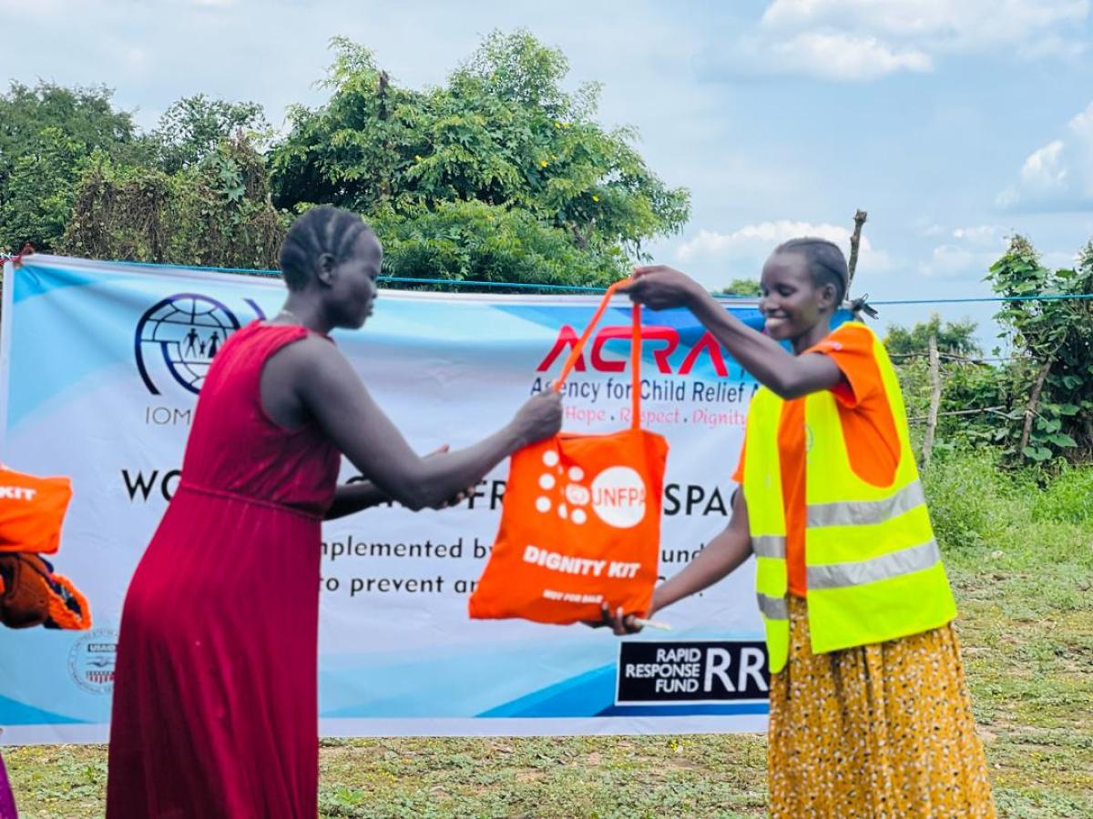 Nyajal receives a dignity kit in Mauwut. 