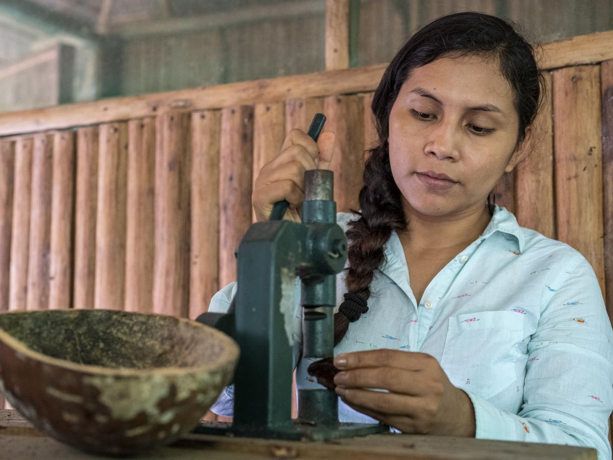 Yacxeri cracking a Brazil nut