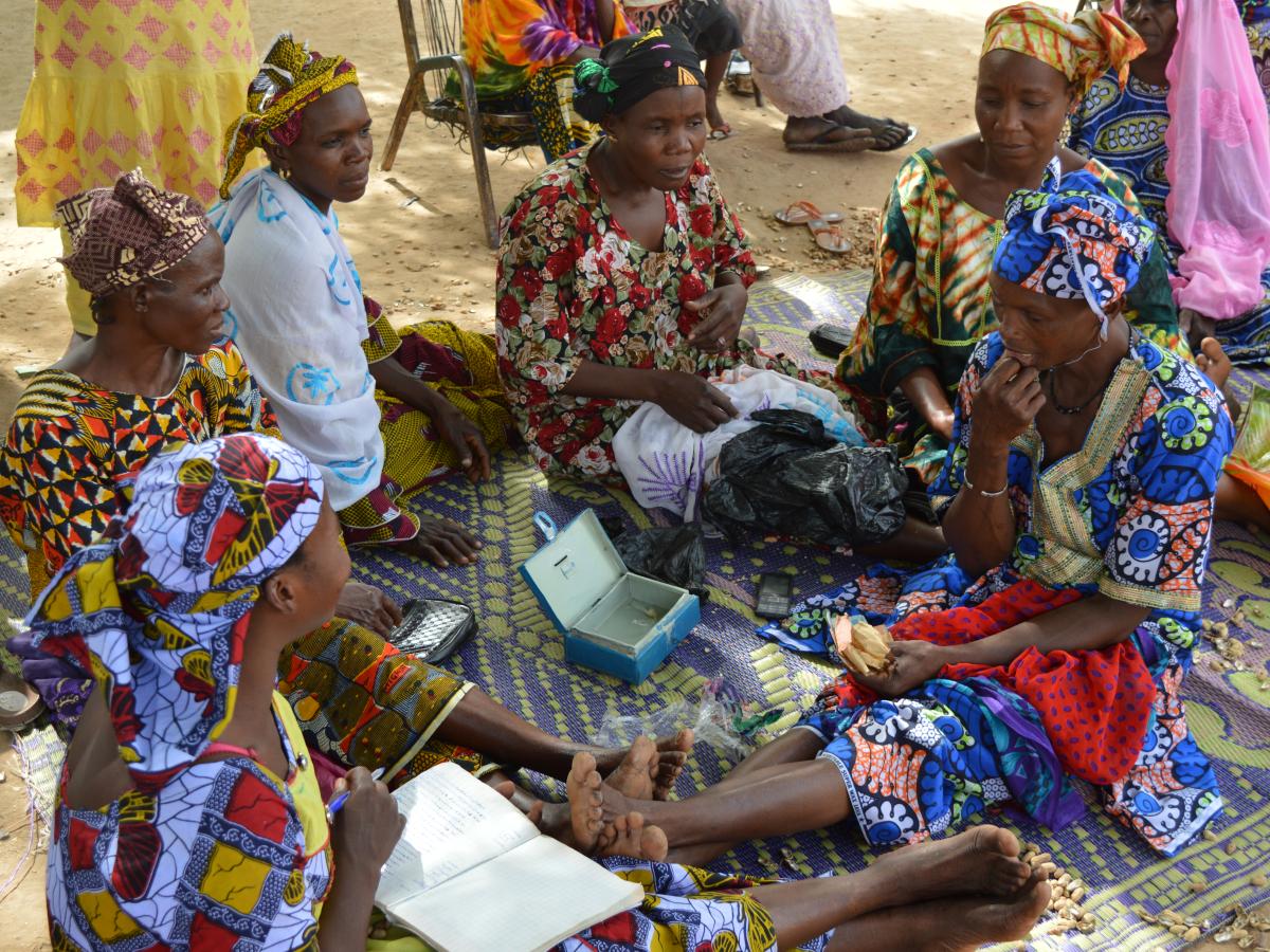 Women collecting money for their health care expenses