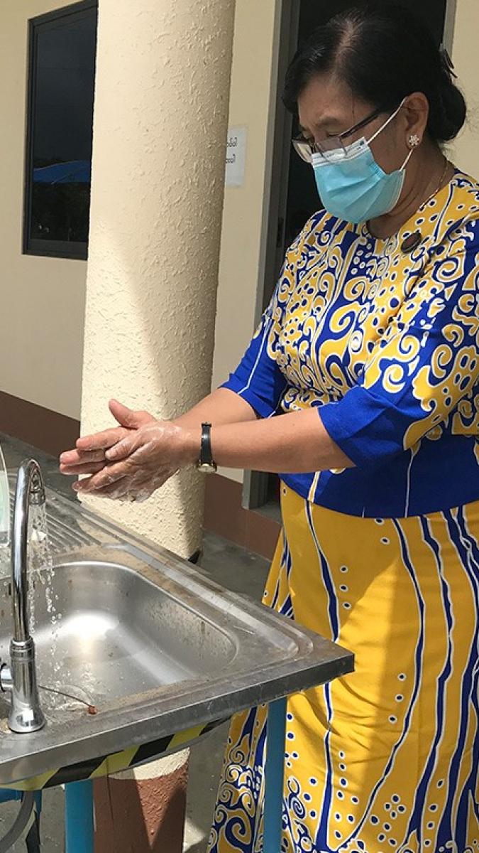 Health workers and clients from the clinics follow the social distancing guidelines, wear PPE, and provide handwashing facilities to prevent the spread of COVID-19.